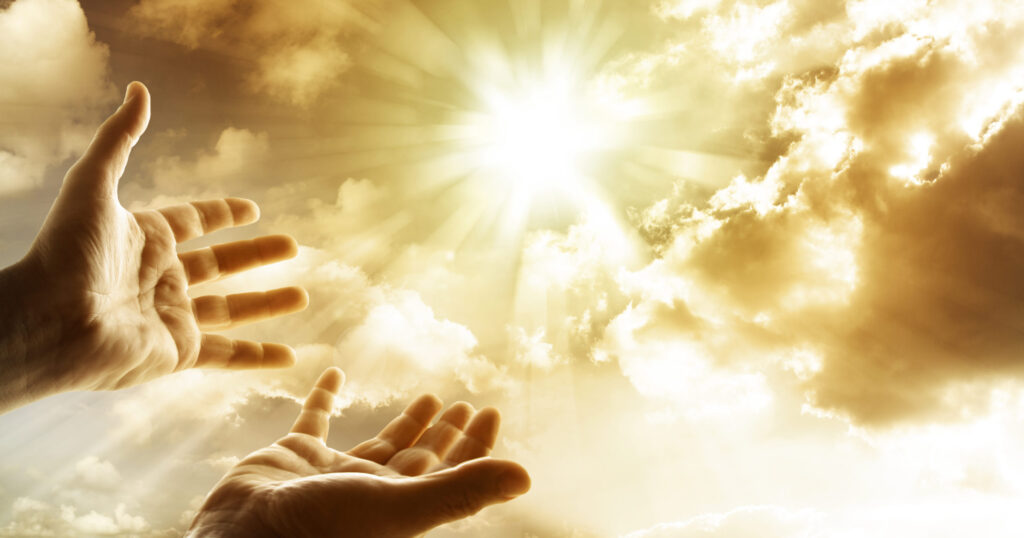Hope for the future in God, with hands reaching for the sky