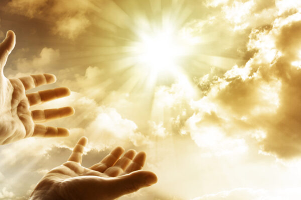 Hope for the future in God, with hands reaching for the sky